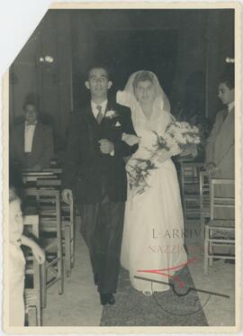 Karmenu and his wife Guza walking out of their wedding ceremony