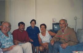 Karmenu and his wife Guza sitting with three other people