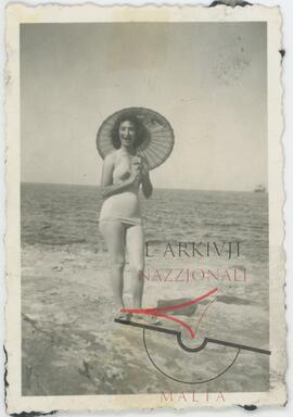 Woman posing for photo at a beach