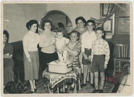 Family gathered around a tape player