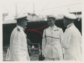 3 marine officials chatting