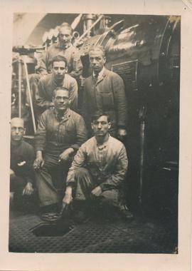 Ċensinu and colleagues in front of a turbine