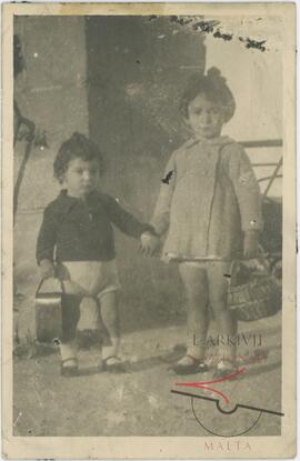 2 young girls posing for a photo