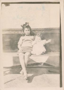 Jean Despott and baby brother Carlo on a bench