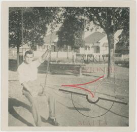 A man on a swing in a park