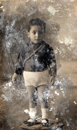 A young boy wearing Fascist black shirt