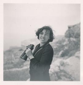 Loulou Pizzuto with binoculars at Dingli Cliffs