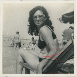 Woman posing for a photo at the beach