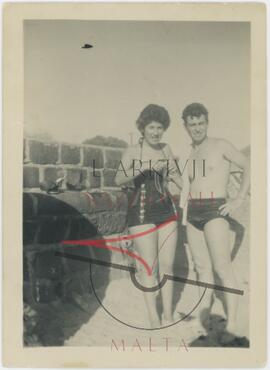 A man and a woman, probably Gruppetta and his wife Josephine, pose in their bathing suits