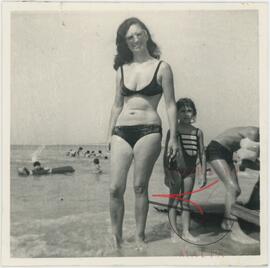 Woman posing for a photo at the beach