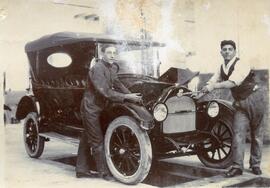 An unknown motor car undergoing maintenance