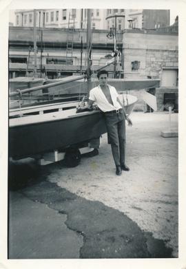 Arthur posing by boat