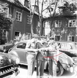 A Maltese Chaplin and  soldiers in Germany