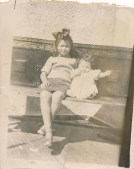 Jean Despott and baby brother Carlo on a bench