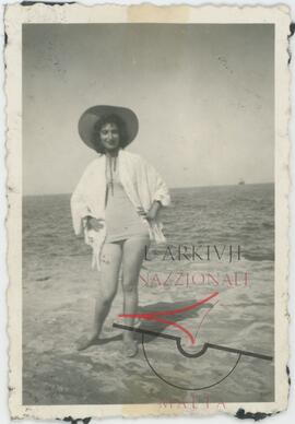 Woman posing for photo at a beach