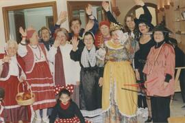 Elderly women dressed in costumes for a party, possibly including Gruppetta's mother