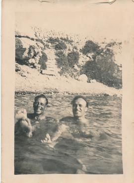 Two men swimming