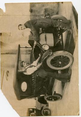 Unidentified motor car and two men