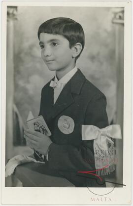 Photo of a young boy on the occasion of his first holy communion