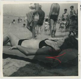 Woman posing for a photo at the beach