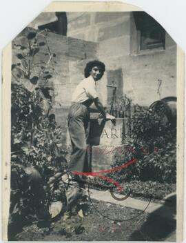 A woman at an outdoor washing basin