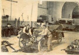 Unidentified motor car and three men