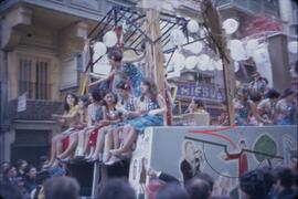 Carnival with people on float wearing costumes