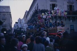 Carnival with people on float wearing costumes