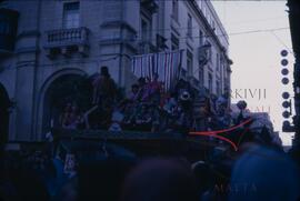 Carnival with people on float wearing costumes