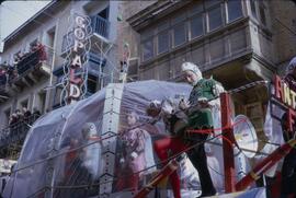 Carnival with people on float wearing costumes