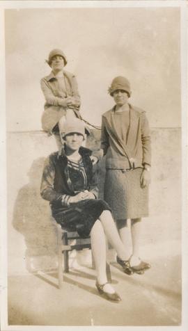 Three young women posing for a photograph