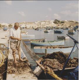 A fisherman in Marsaxlokk Bay