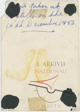 Verso of Woman posing for a photo at Castille Square