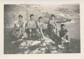 A group of young men over Għajn Tuffieħa Bay