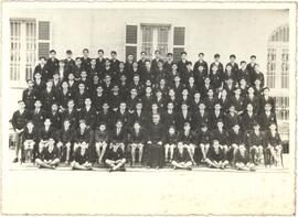 Young students and their teacher posing for a photograph