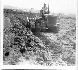 Guzi Cascun on a chain tractor (a)